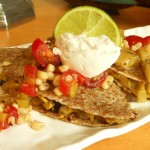 Vegan Cheesy Yellow Squash Quesadillas Topped with Grilled Green Tomato and Charred Corn Salsa