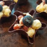 Red-White-and-Blue Salad in Blue Corn Chip “Stars” <br> (red beans & white hominy with a blueberry garnish)